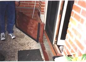 Figure 11: This Baton Rouge home has a steel door with gaskets that seal when closed Figure 12: The same Baton Rouge home has thin facing brick placed over the waterproofing materials Figure 13: