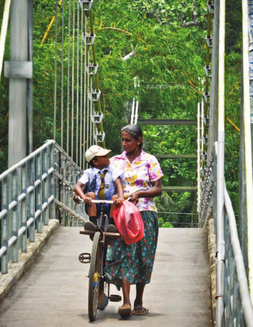An ADB-funded suspension bridge links two villages on either side of a river
