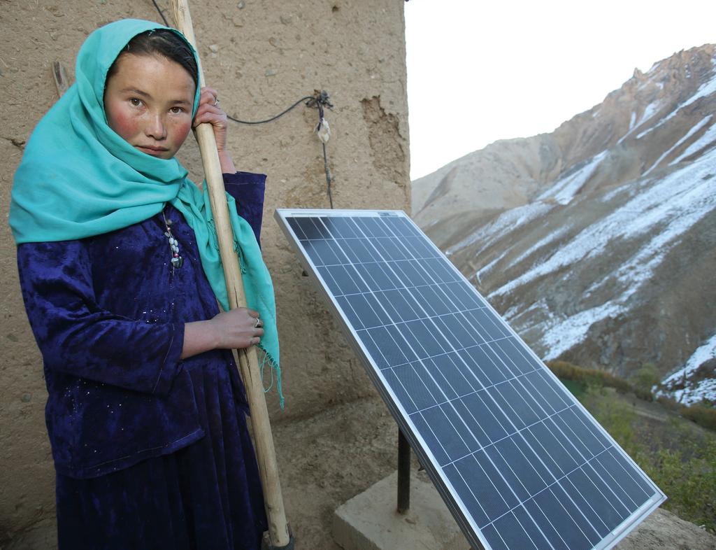 Najiba 15 years old from Afghanistan. The solar panel is her family s source of energy.