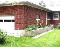 Figure 3-3: This home is surrounded by a floodwall, but the garage door must be sandbagged when the area floods.