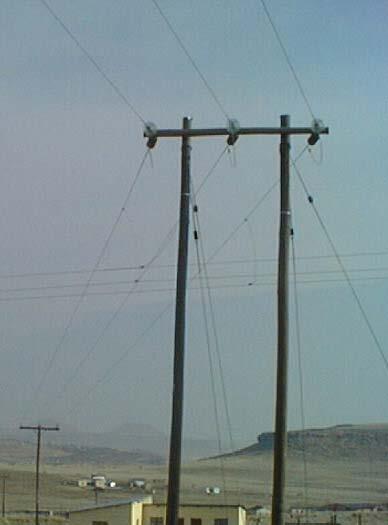 Affordable connections for users and Government of Rwanda Controlling costs Technical specifications were revised: Changing from lattice framed steel towers to wooden poles (below) Using single-wire