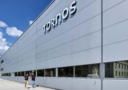 consolidating brand portfolio under one single brand: Tornos Concentrating machine assembly in one building in Moutier Rue Industrielle