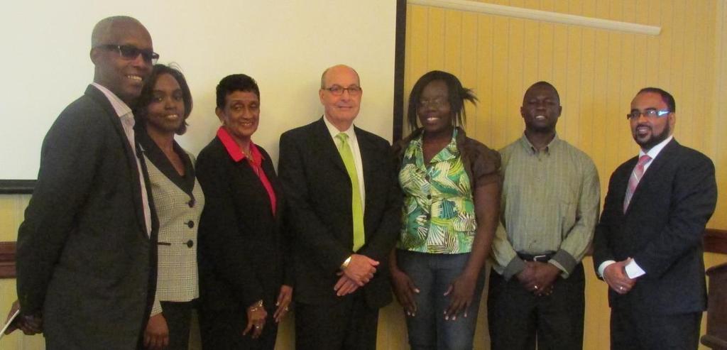 CCRIF-UWI (University of the West Indies) postgraduate scholarship winners 2014/15, Sherryann Prowell (3 rd right) and Ronn Sullivan (2 nd right) with, from left, Mr. Clement Iton, UWI Registrar, Mrs.