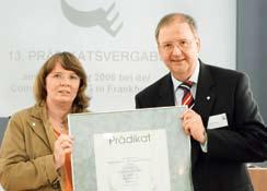 37 Total E-Quality: Bayer equal opportunity compliance specialist Dagmar Diergarten holds the certificate with Wolfgang Schenk, also of Human Resources.