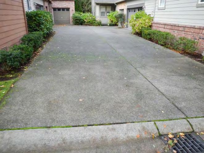Concrete Flatwork There are concrete sidewalks, concrete driveways, squared extruded concrete curbing, and roll over concrete curbing that are the