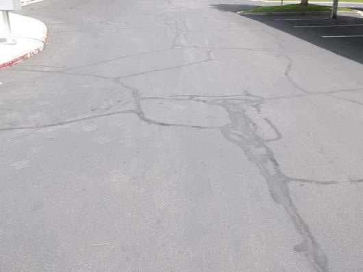 Cracking was noted at the time of the inspection. An asphalt overlay generally has a useful life of 20-25 years.
