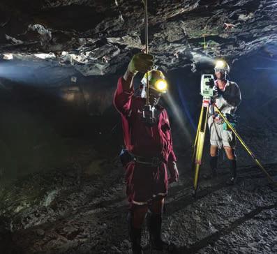 Strategic report 02 01 03 01 Survey assistant Lennox Mxathule and surveyor Zack Moatshe carry out an underground survey of Bathopele mine.