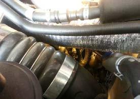 It is accessible between the Intercooler Tube and Radiator