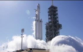 SpaceX conducts 1st static fire test of Falcon Heavy rocket SpaceX simultaneously fired up all 27 engines on its new massive Falcon Heavy rocket.