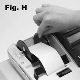 Place the paper roll in the paper holder so that the paper will feed out from the bottom of the roll toward the front of the register. 5.