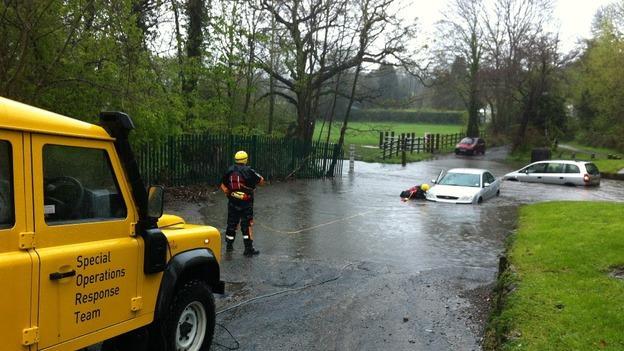 rescue team helps a stuck car at Ford