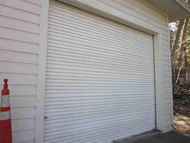 Association Reserves -SF, LLC Client: 26862D Floriston - School House/Park Comp # : 702 Roll-up Garage Door - Replace Quantity: (1) Door Location : At school house History : Evaluation : Good