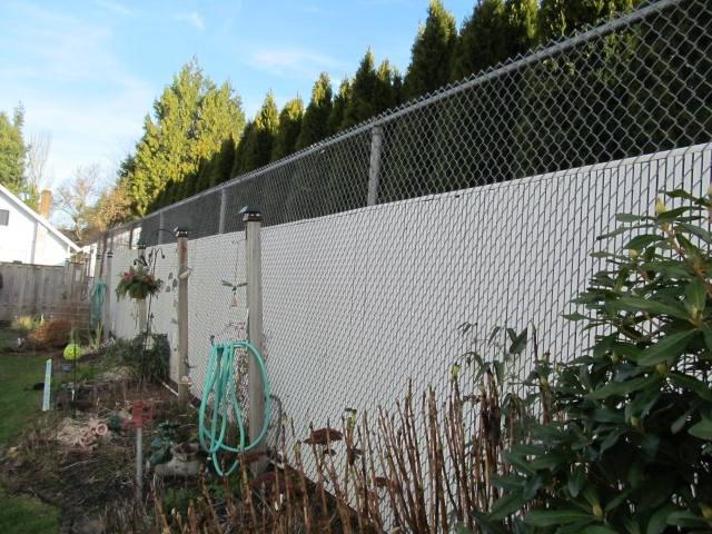 property perimeter Evaluation: Replacement of previous wood fencing at this location with apparent transition to chain link utilizing vinyl slats.