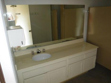 Comp #: 909 Bathroom - Refurbish Quantity: (2) 80 GSF Rooms Location: Pool building Evaluation: The bathrooms are visibly aged.