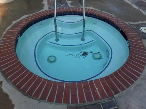 Comp #: 1203 Spa - Resurface Quantity: (1) 8' Diameter Spa Location: Center of property Evaluation: The spa appears to be aging normally. No signs of any heavy fading or grime build up.