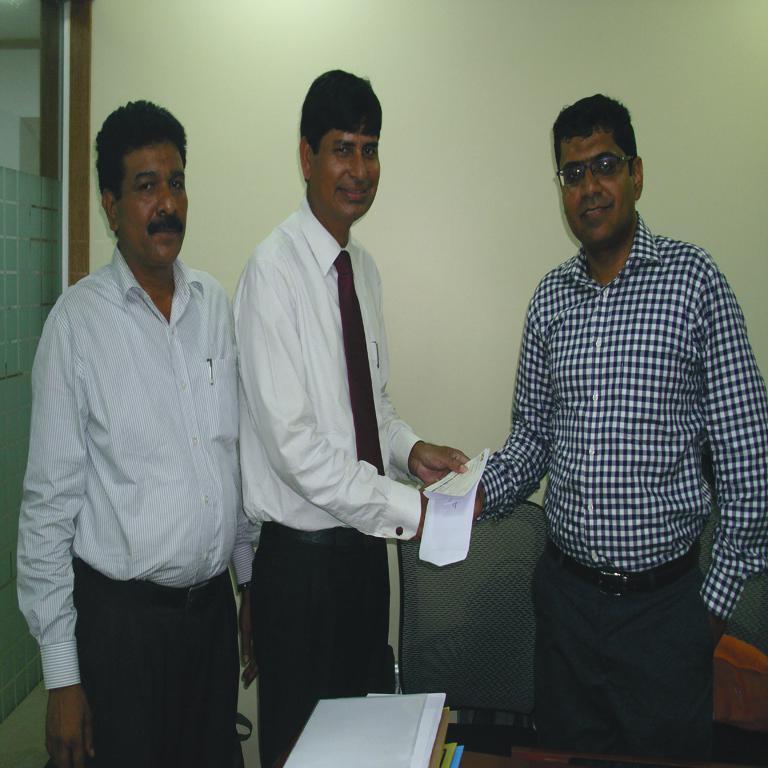 Md. Mosharrof Hossain, Chief Executive Officer (Incharge) is seen handing over a Marine Claim Cheque to Mr.