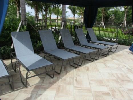 Pool and Tennis Comp #: 2763 Pool Deck Furniture - Replace Quantity: Approx (322) Pieces Location: Pool deck Evaluation: (200) lounge chairs, (21) dining tables, (87) chairs, (7) trash cans, and (7)
