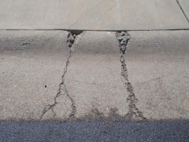 and gutter is broken and should be replaced prior to the future asphalt overlay Typical concrete