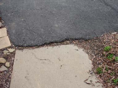 There are a number of locations where potholes have formed as the result of the failure of the underlying base material or the surface material.
