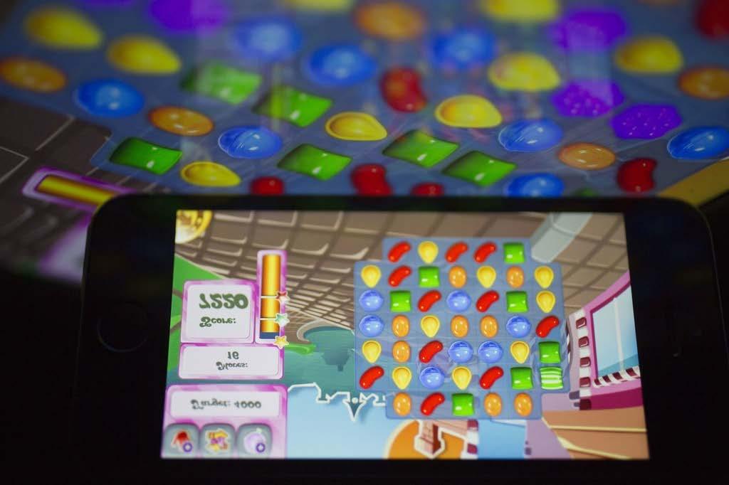 The Candy Crush Saga game is displayed on an Apple Inc.