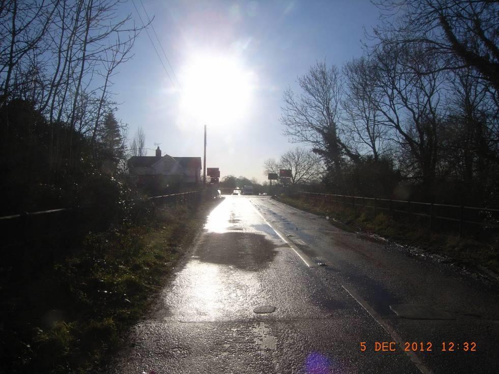 View of road approach 45m from wig wag signals (2 secs at 49 mph) Photograph taken at the same time on the following day, under near-identical