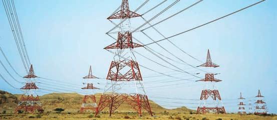 Power Transmission & Distribution IC Transmission line towers designed and installed by L&T, traversing the deserts of the Gulf.