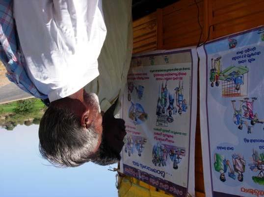 An illiterate reads a poster! Mr Murali wanted to know whether the ongoing campaign of Rural Employment Guarantee Scheme was reaching the remote corners of the village.