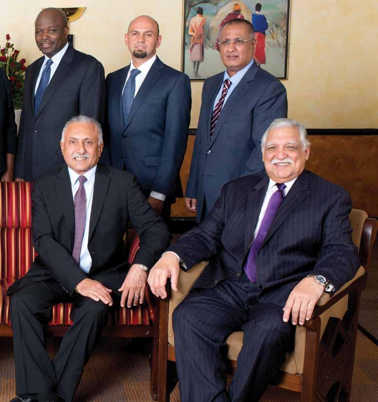 11 Seated (left to right) Amin Merali Nasim Devji (Group CEO & Managing
