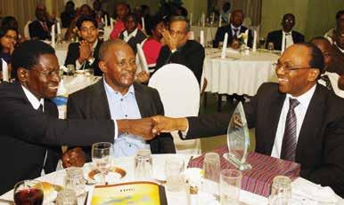CPAs, Fawn Cousens (L) and Pius Bahemuka, ICPAU s past CEO (R) engaged in a
