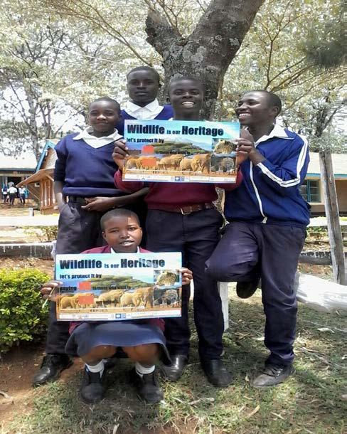 Muslim Girls Primary School in Chuka as they received their posters WCK Lelel Secondary School Wildlife Club members.