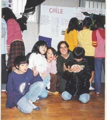 Members of social welfare groups from Latin America visiting Japan as part of a Youth Invitation Program with elementary school children.