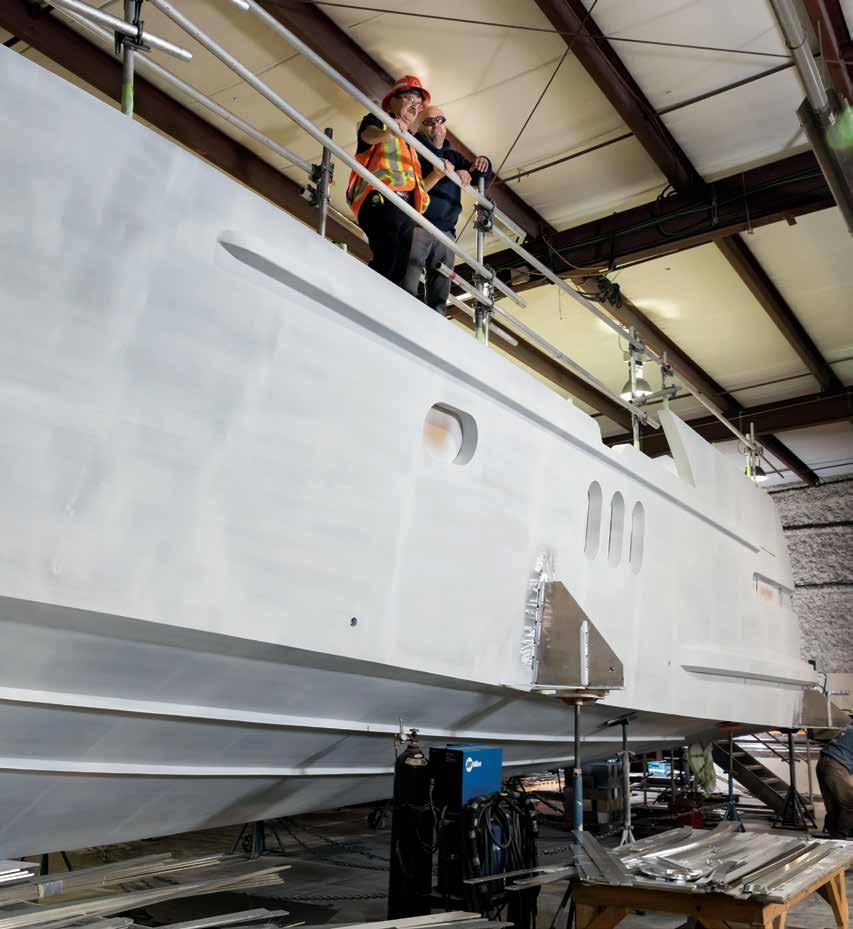 On the Cover WorkSafeBC occupational safety officer Mark Benoit and Coastal Craft safety officer Jeremy Berlinger survey the final stages of a boat build.