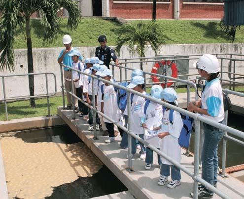57 Annual Report 2007 Educating the children on water treatment process. Auxiliary police personnel attended the basic training at the Police Training Centre.