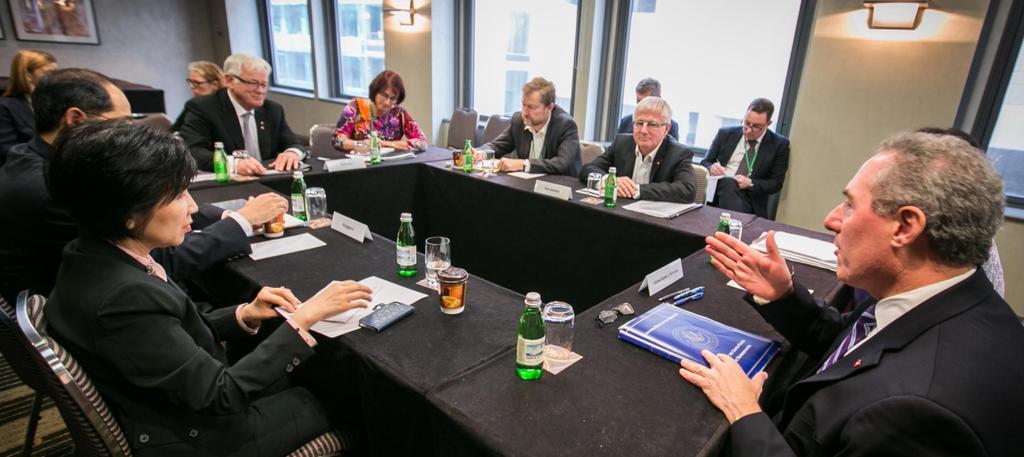 A BUSY FORWARD NEGOTIATING AGENDA Image- negotiations, ministers round a table.